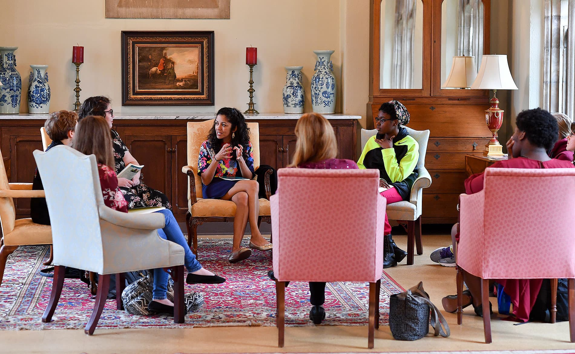 Visiting writer talking casually with students