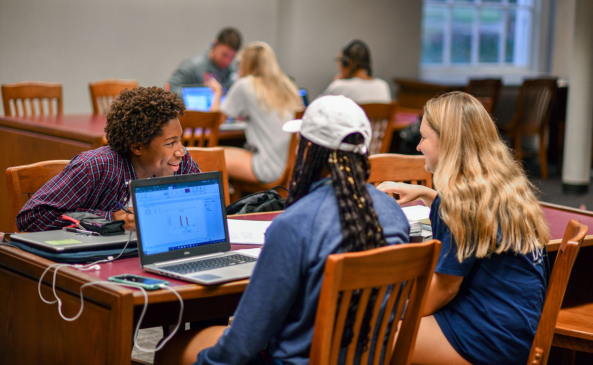 Group of students studying at the library