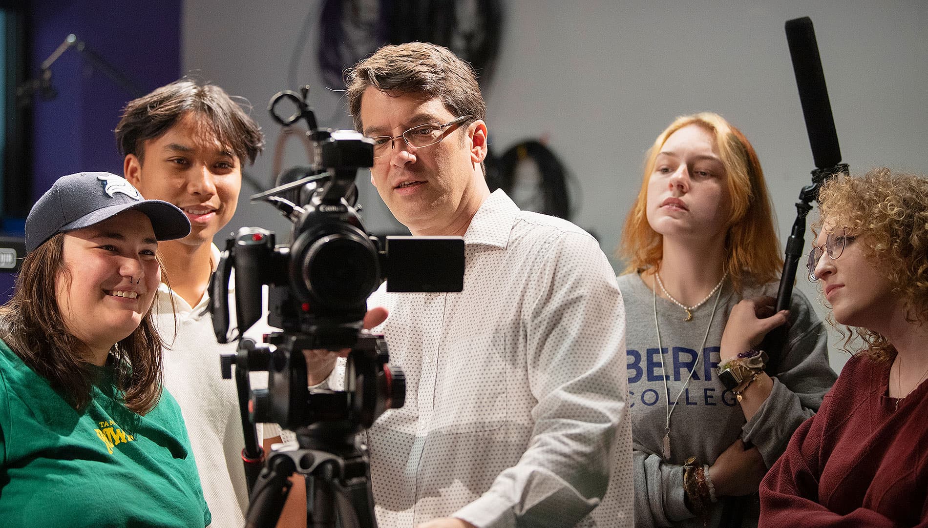 Students behind a camera with a professor at Viking Fusion