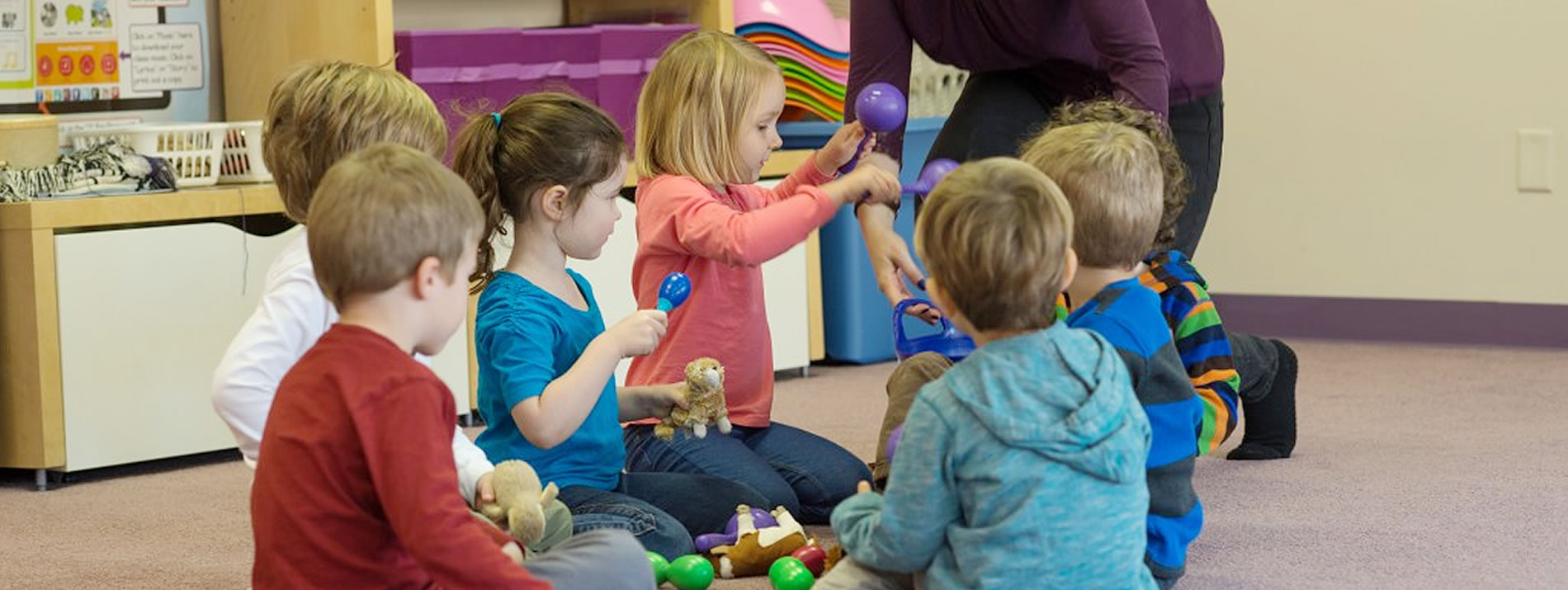 group of kids shaking maracas