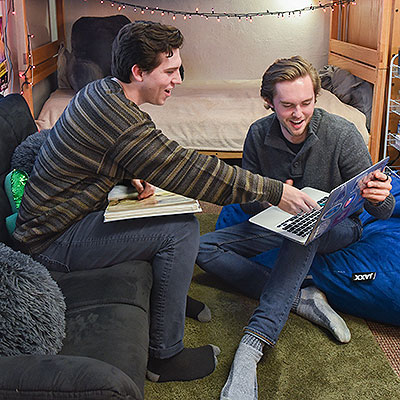 students working on a laptop in the Winshape dorm